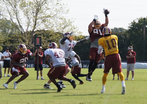 Ryan Kerrigan knocks down an RGIII pass. Photo by Terri Russell.